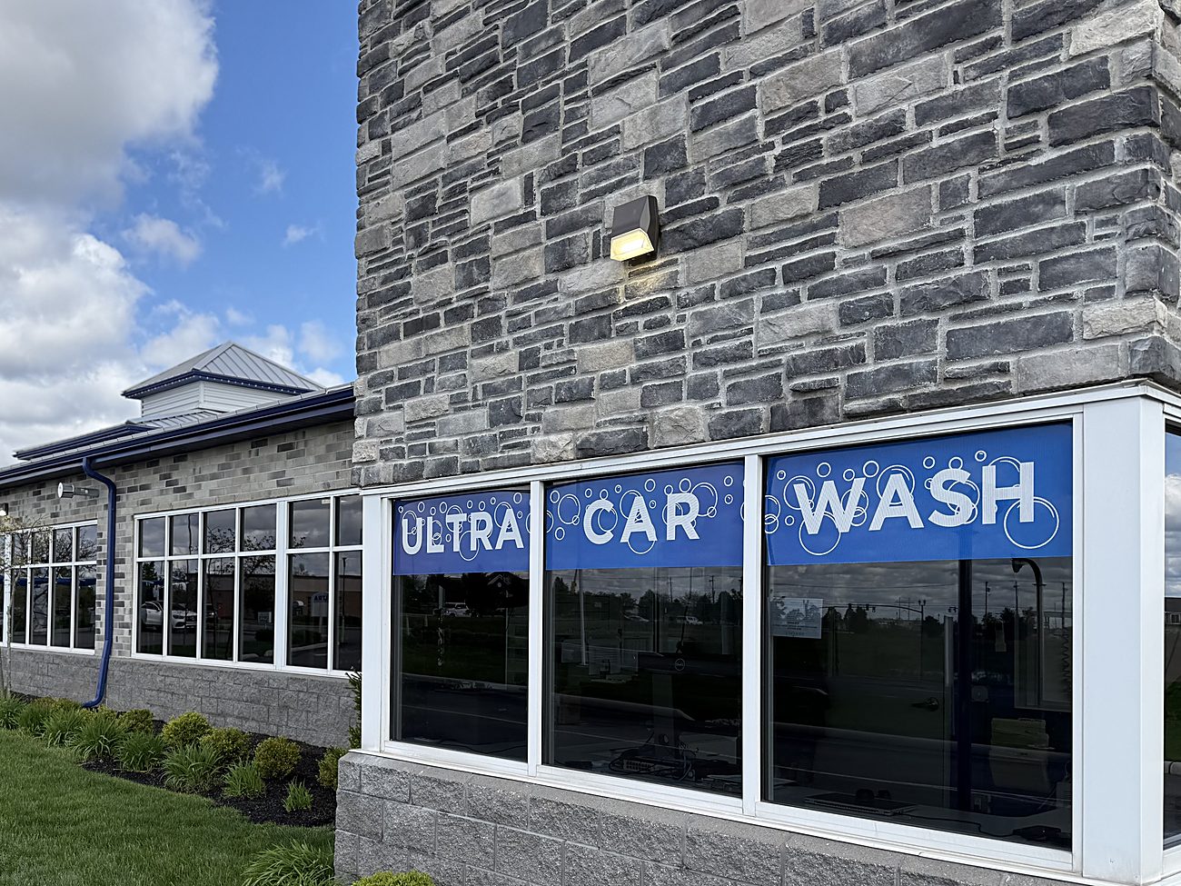 Ultra Car Wash stone building and sign