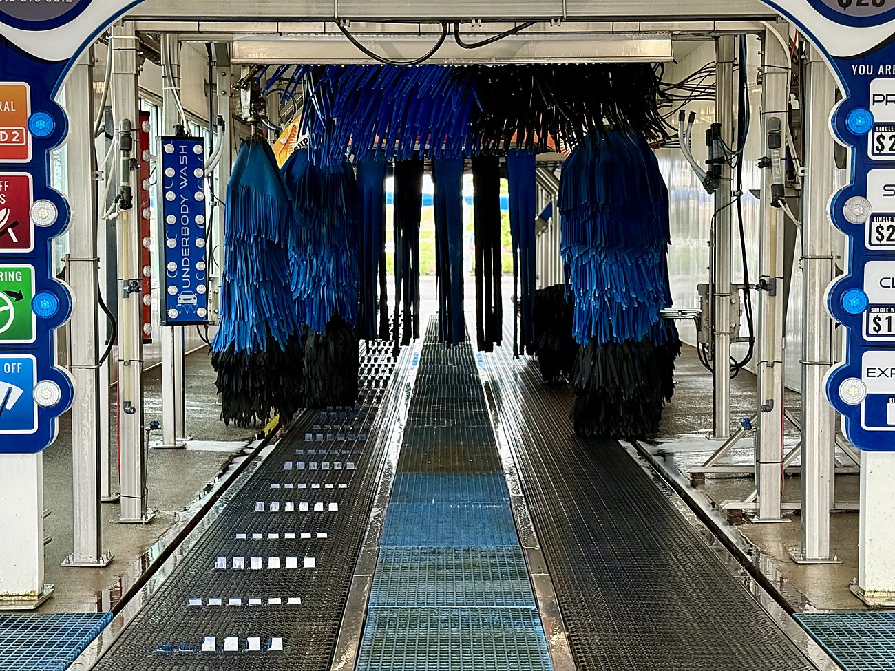 Inside the Ultra Car Wash express tunnel with foam applicators