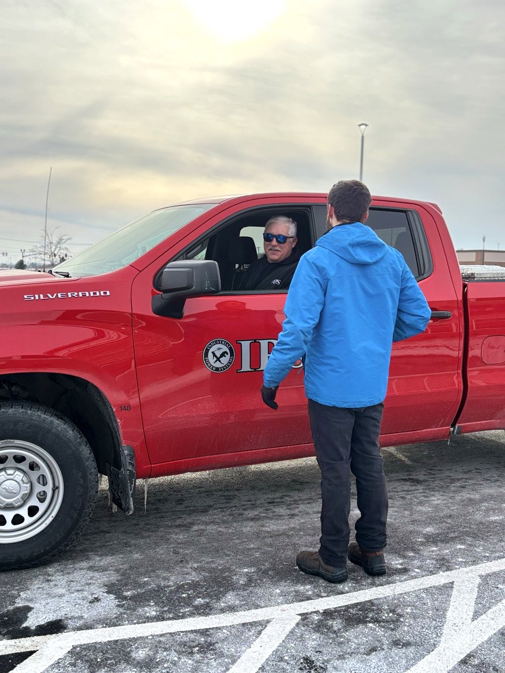 Ultra Car Wash team member assisting a fleet customer